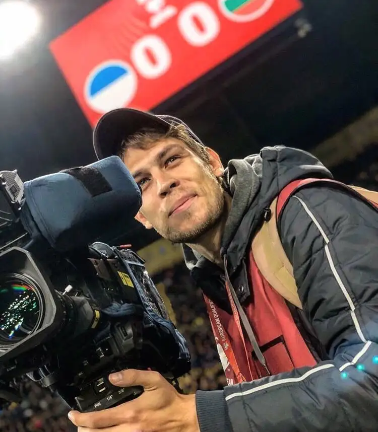 Alex Melnykov filming football from the touchline